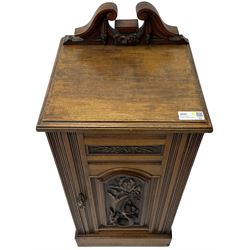Edwardian bedside cabinet, raised broken swan pediment back, single panelled cupboard door decorated with applied carved seahorse motif and foliate patterns