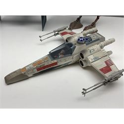 Star Wars - four space/land vehicles comprising Millenium Falcon with hinged top and figures; TIE Fighter; X-Wing Fighter with pilot; and AT-ST 'Chicken Walker' transporter; all unboxed (4)