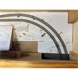 'Z' gauge continental scenic layout with folding legs, various loops of track and sidings with overhead cables, buildings including water tower, tunnels, roads with motor vehicles and figures, trees, haven with boats, backdrop diving wall hiding control units 150 x 50cm