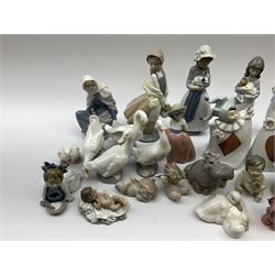 Collection of Nao figures, including four playing card jesters, two clowns, Virgin Mary and baby Jesus , five geese etc. 