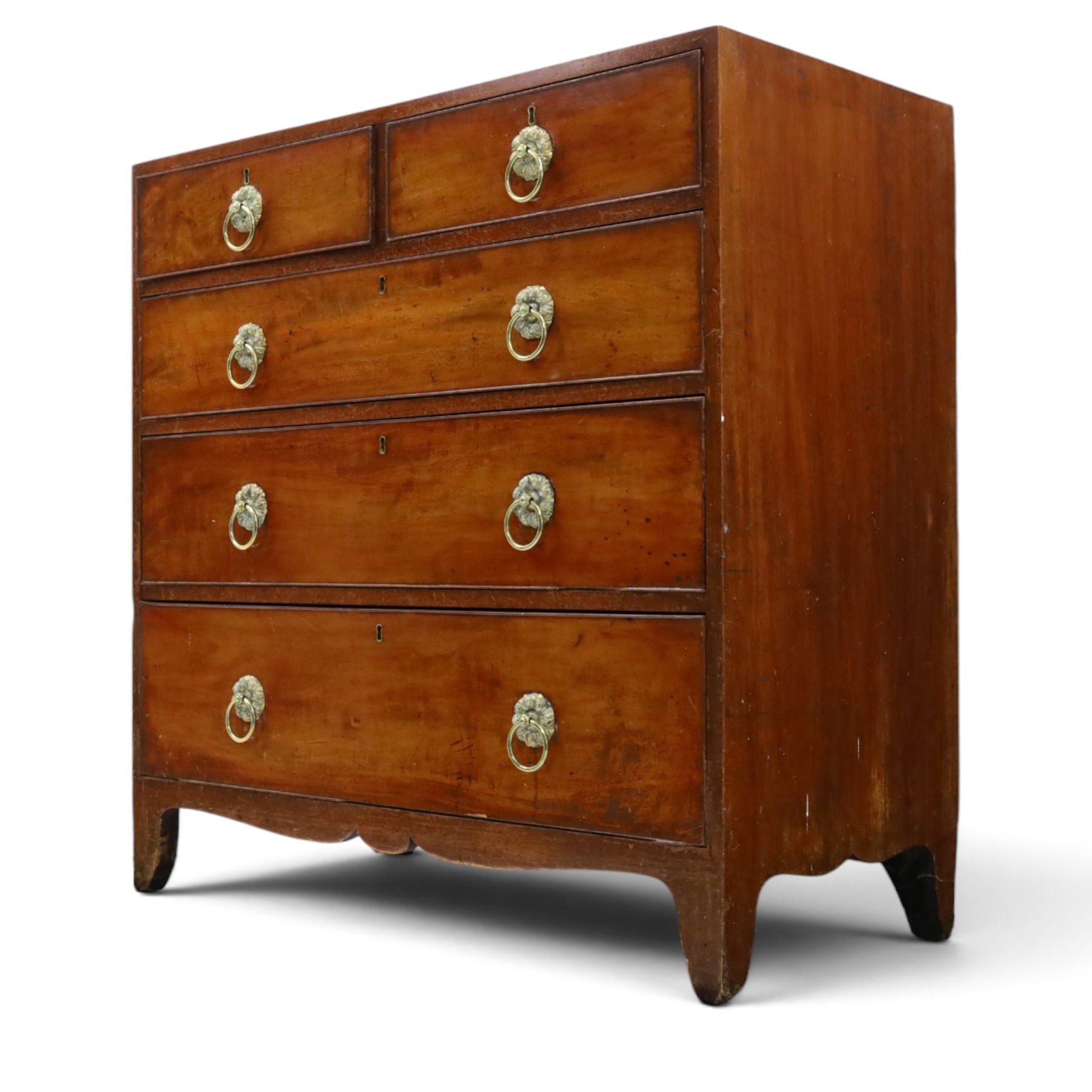 George III mahogany straight-front chest, two short over three long graduating drawers, cockbeaded edges with brass rose handles, raised on shaped supports
