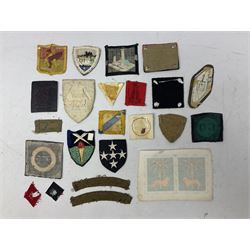 Approximately one-hundred printed and embroidered cloth badges including Royal Tank Regiment, Royal Armoured Corps, 219th Independent Infantry Brigade, Cyrenaica, Cyprus, Singapore and other districts, Gibraltar Garrison, East Anglian Brigade, 20th Armoured Brigade and various armoured divisions etc