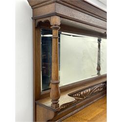 Arts and Crafts period oak mirror back dresser, projecting cornice above rectangular bevelled mirror and shelf, two turned supports, inset copper panel with embossed decoration, rectangular moulded top over two drawers and two panelled cupboard, moulded plinth base, brass and copper strappings and handles 