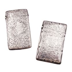 Small late Victorian card case, of rounded rectangular form with hinged top, engraved with monogram and clover surround, hallmarked Joseph Gloster, Birmingham 1898, together with another similar Edwardian example, with engraved dedication to cartouche and scrolling foliate decoration, hallmarked Robert Chandler, Birmingham 1909, approximate total weight 3.16 ozt (98.2 grams)