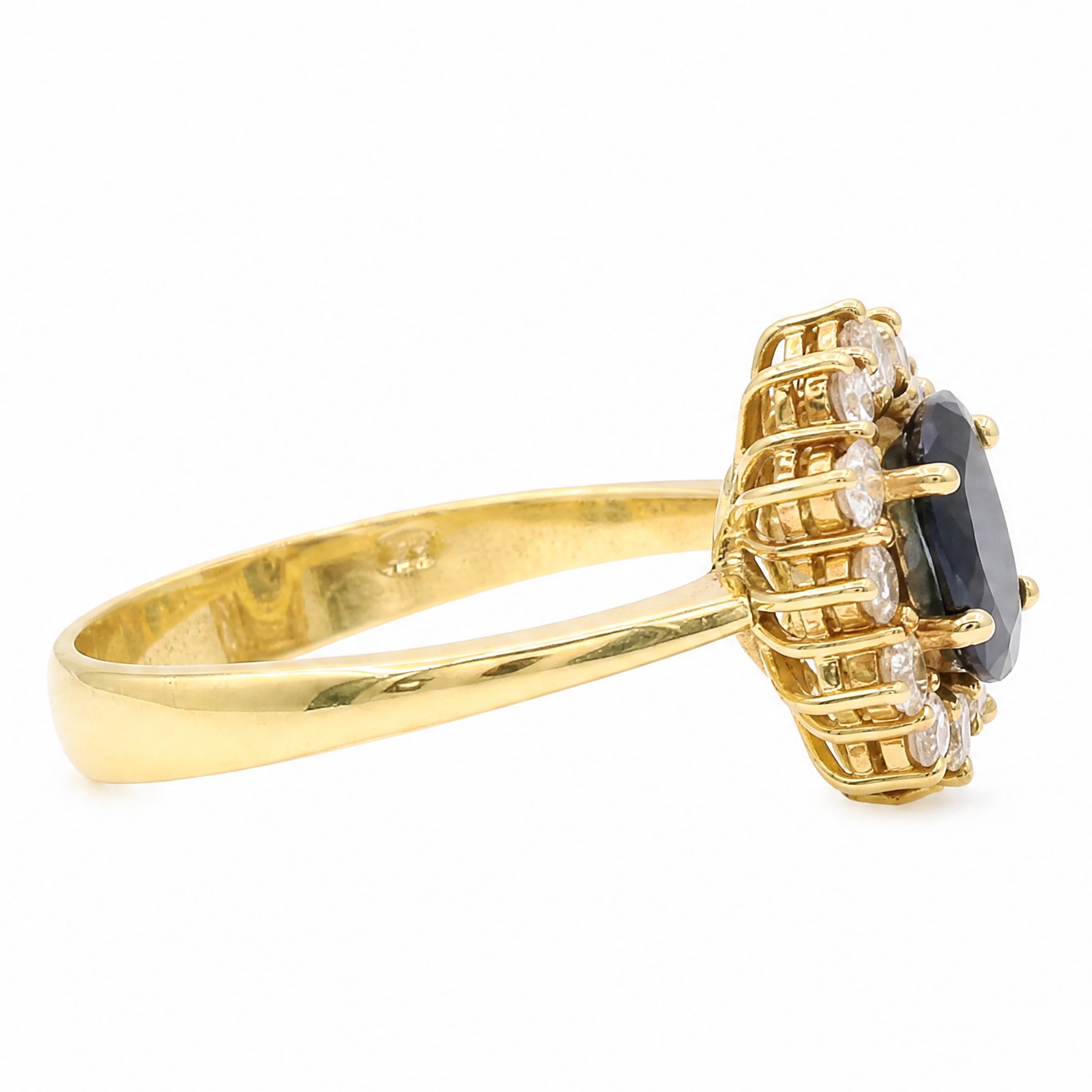 18ct gold sapphire and diamond cluster ring, single oval cut sapphire of approx 1.05 carat, surrounded by twelve round brilliant cut diamonds, stamped 750, total diamond weight approx 0.25 carat