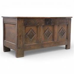 18th century oak blanket chest, plank top with iron strap hinges, above carved frieze abov...
