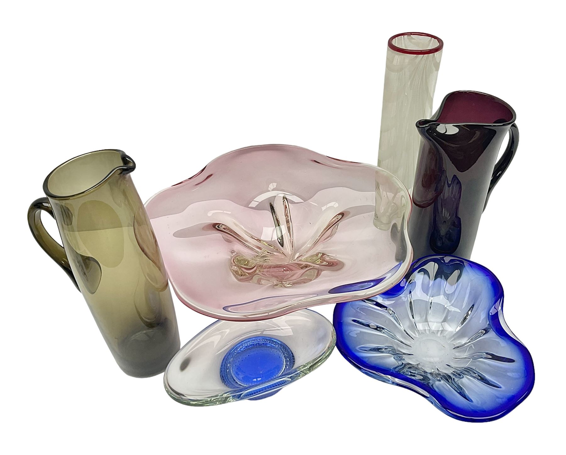 Two Whitefriars glass jugs, together with a Swedish Pukeberg art glass vase and three art glass bowls, including large pink example, some signed to base, tallest H30.5cm