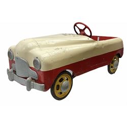 1950s child's tin-plate pedal car, possibly by Tri-ang, painted white and red and named 'Crusader' L104cm