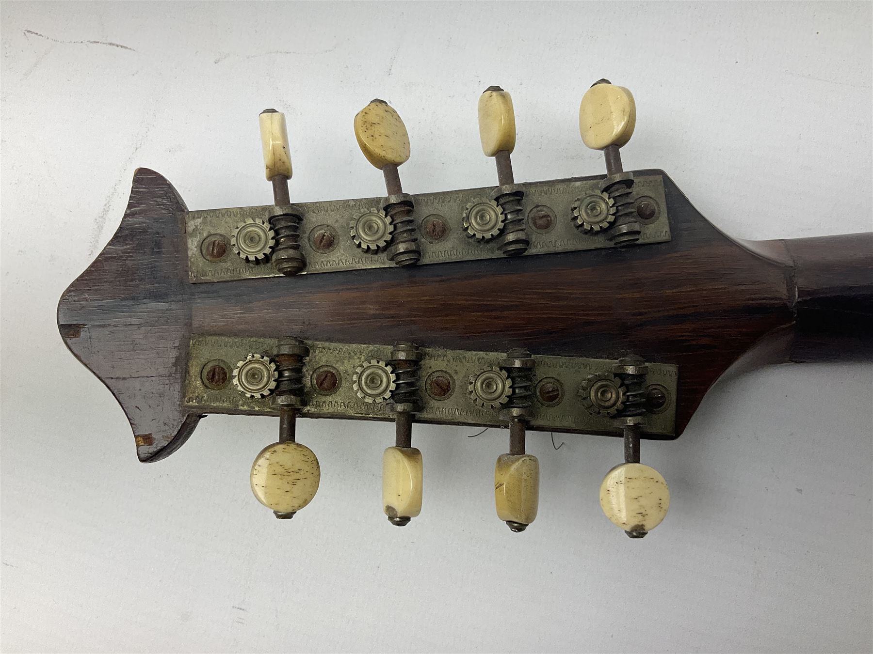 Italian mandolin, with foliate inlaid scratchplate, paper label inscribed 'Carlo Loveri & Figlio of Napoli', L62cm