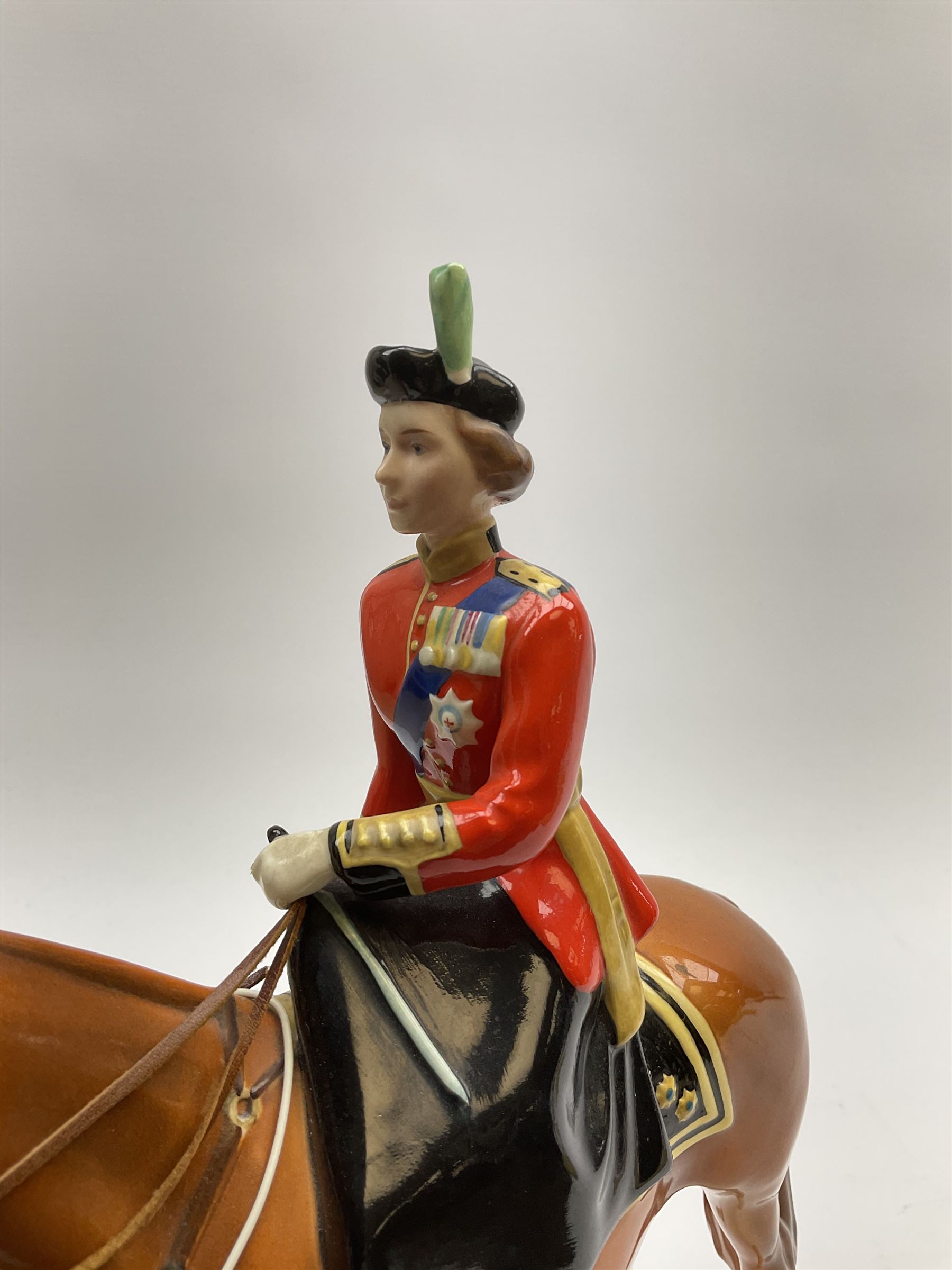 A Beswick model of HM Queen Elizabeth II mounted on Imperial Trooping the colour 1957, model no 1546, H26.5cm.