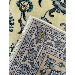 Persian Nain pale sage ground carpet, decorated with curled leaf motifs and palmettes, the busy borders decorated densely with similar design, within floral pattern guard stripes 