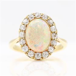 Early 20th century gold opal and diamond cluster ring, single oval cabochon opal, surround...