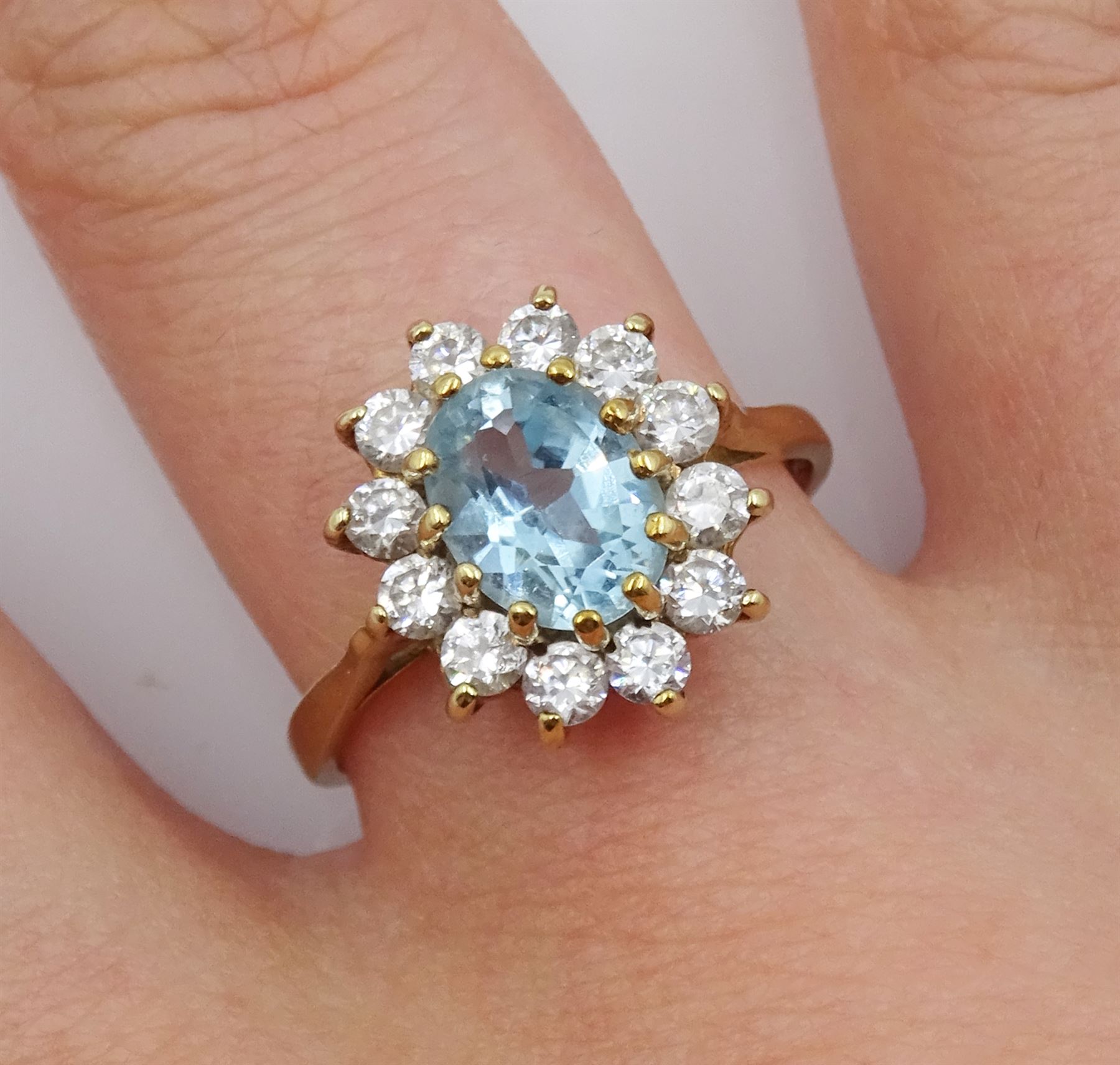 9ct gold oval blue topaz and cubic zirconia cluster ring, hallmarked 