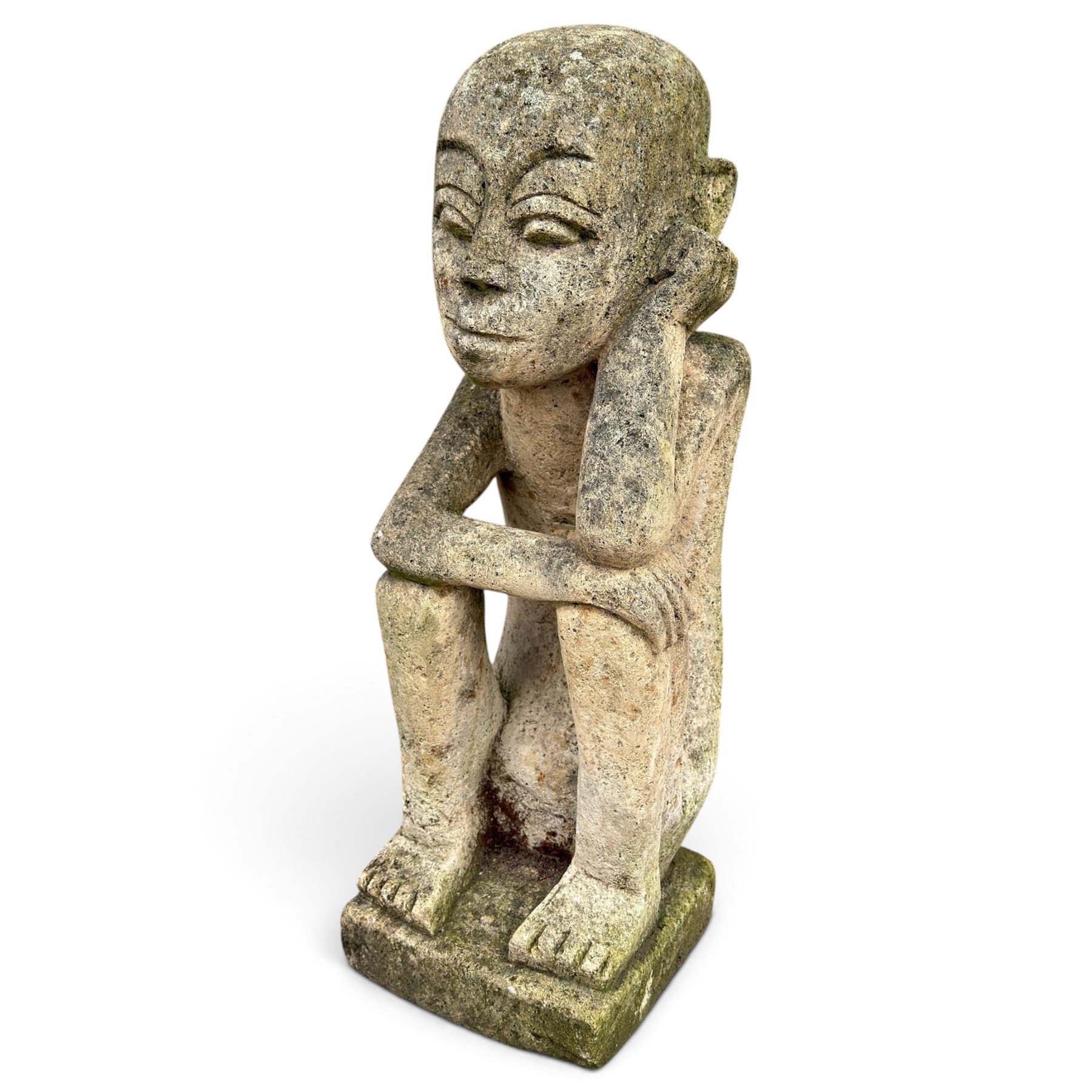 Balinese design weathered cast stone figure of an ancestral guardian, modelled in a squatting pose 