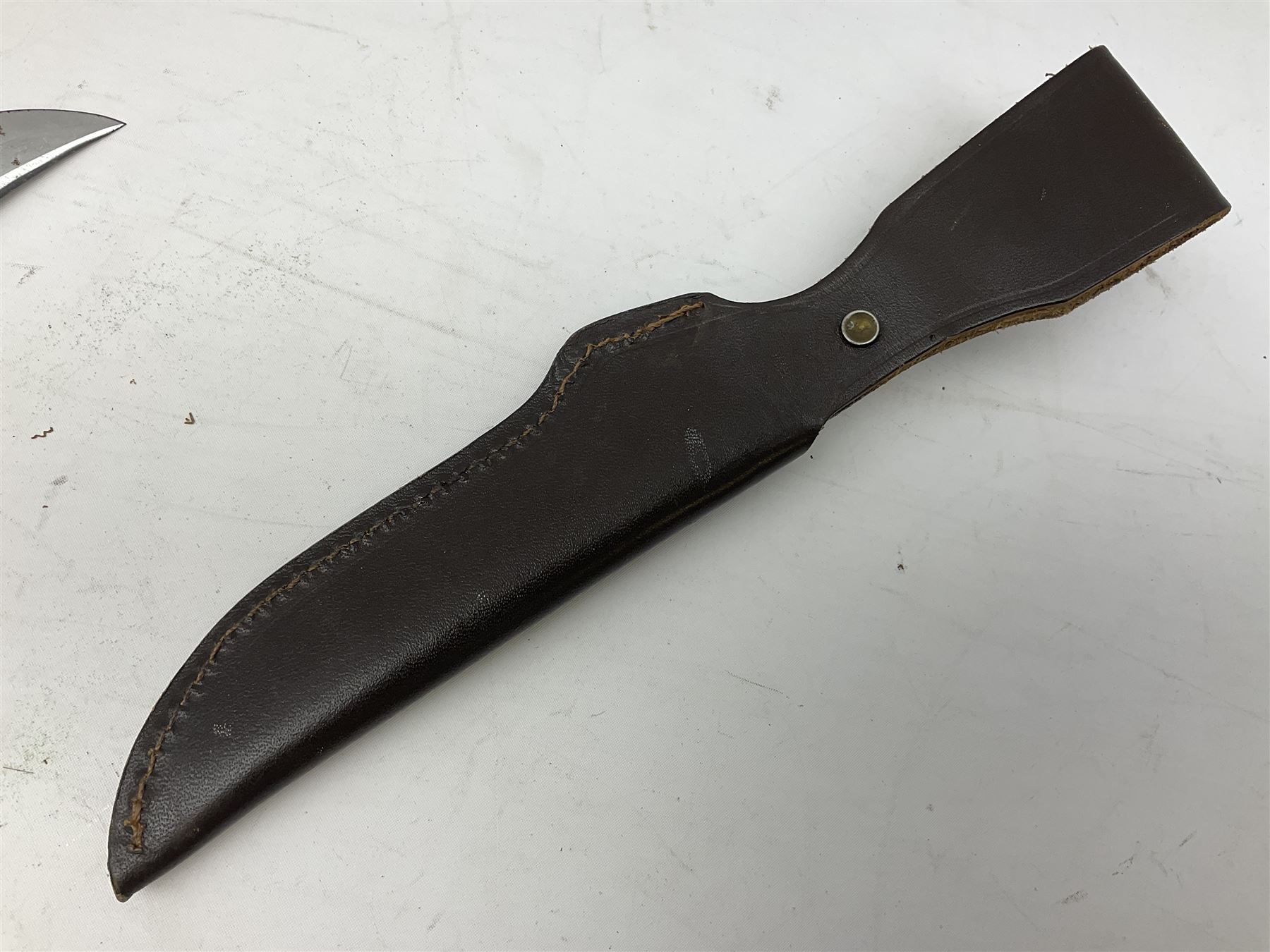 German Puma Skinner knife, the 13cm steel blade marked model 6393, serial No.55472 to guard, fixed blade, antler scales; in original hard plastic case; with brown leather sheath L29cm overall