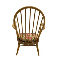 Ercol - beech low easy armchair, with upholstered loose cushion in floral patterned fabric 