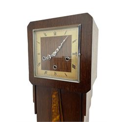 English - Early 20th century 8-day oak cased Art Deco grandmother clock, with a square chrome dial bezel, wooden dial centre bordered by Roman numerals on a cream background, matching chrome hands and strike silent facility, three train Enfield going barrel movement, chiming the quarters and sounding the hours on eight gong rods, with a wooden pendulum and brass cylindrical bob.  