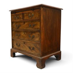 George III mahogany bachelors chest, rectangular top with moulded edge, fitted with brushing slide over two short and three long cock-beaded drawers with brass swan-neck handles, lower moulded edge on bracket feet