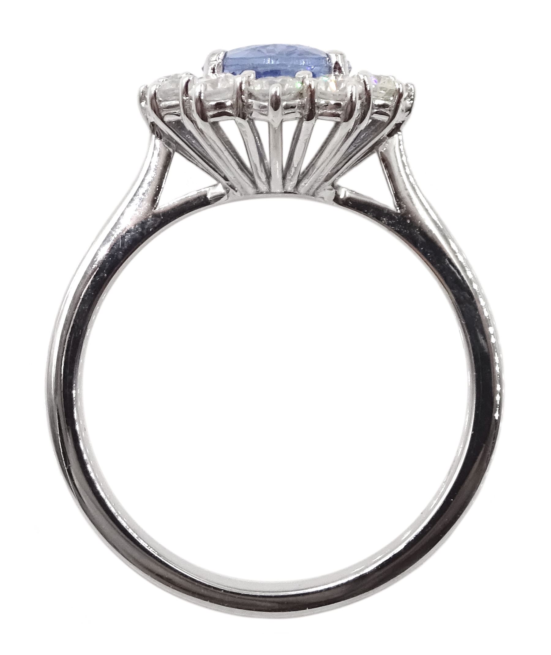 18ct white gold oval Ceylon sapphire and diamond cluster ring, stamped ...