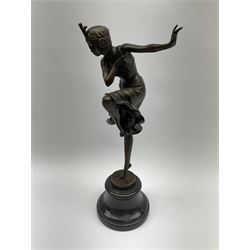 An Art Deco style bronze after Dimetri H Chiparus, modelled as a dancing flapper girl, signed and with foundry mark, upon black marble socle base, overall H39.5cm.