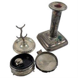 Two sets of cased silver handled tea knives, two silver mounted photo frames, silver mounted candlestick, silver ring holder with weighted base, silver mounted jewellery box