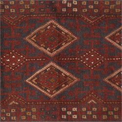 Afghan Meshwani runner, hand-knotted wool pile, indigo ground decorated with a vertical series of angular diamond medallions in tones of madder red, dark blue, framed by geometric borders with flatwoven kilim ends with fringe