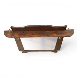 Arts and Crafts oak wall mirror, rectangular mirror plate within shaped frame, raised shelf with shaped back and pierced heart detail, bracket supports and shaped lower rail
