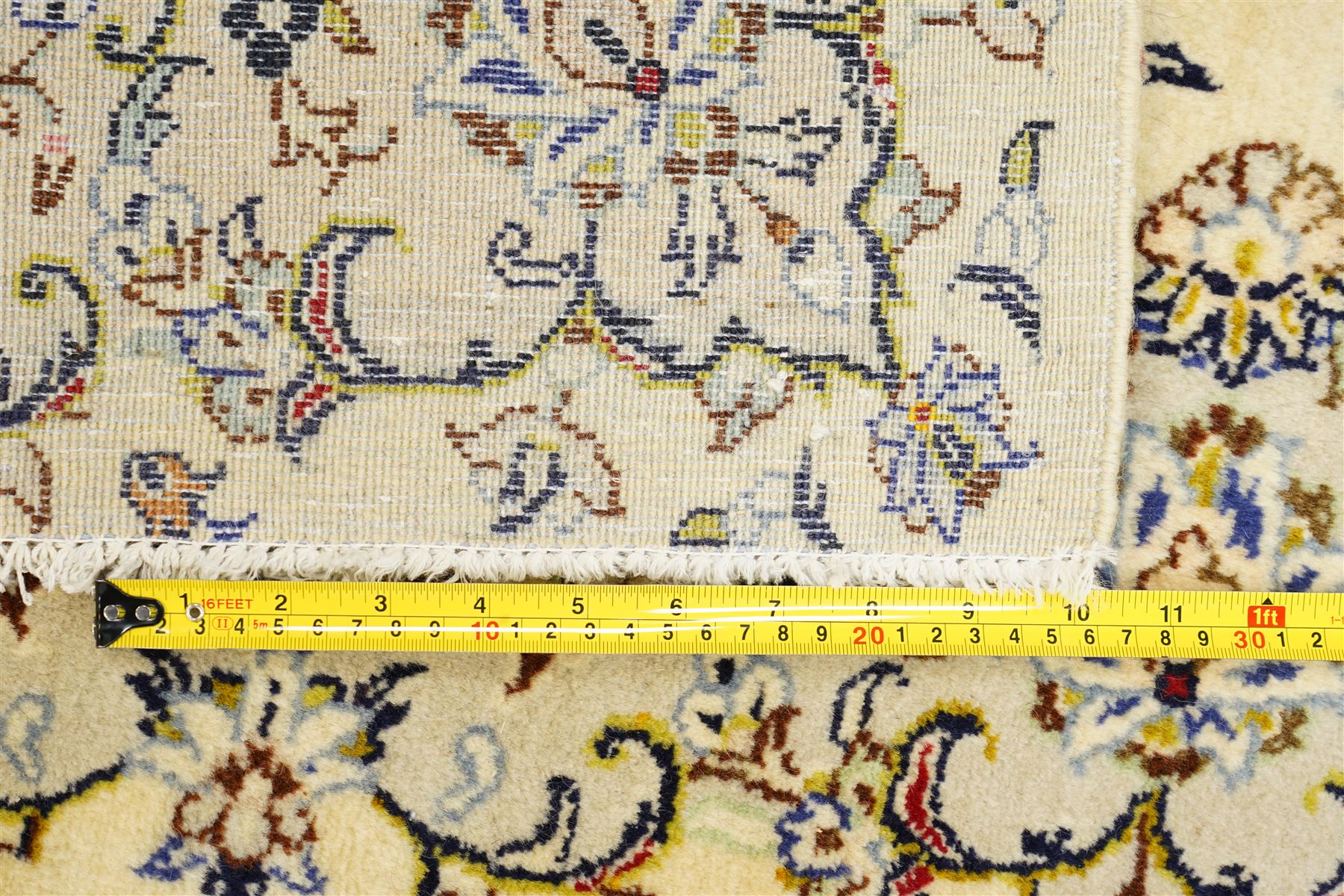 West Central Persian Sarough hand-knotted rug, ivory field with central lobed medallion issuing an all-over design of scrolling vines, palmettes, and floral sprays within conforming spandrels enclosed by a complementary foliate border flanked by guard stripes, with cotton fringe ends 