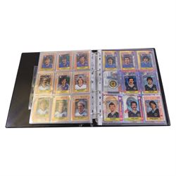 Collection of Football related trading cards, stickers and coins, including 1990 Esso World Cup Coin Collection, an empty 2010 Esso Official England Medal Collection Folder, incomplete 1990 Italy World Cup Commemorative Medal Collection, 1998 The Official England Squad Medal Collection, 1970s Topps All Stars Cards, 1992 Panini Official Football Players cards, Euro 2008 Collectors Binder and Cards, Panini 2009/10 Champions League Stickers, etc housed in four folders