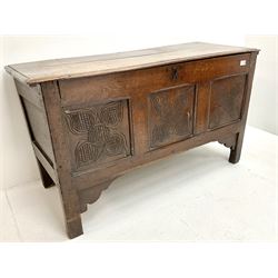 Early 19th century oak coffer blanket box, single hinged lid, three carved front panels, stile supports 