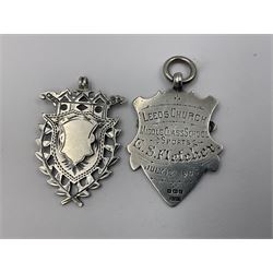 Seven Edwardian and later silver cartouche fobs, to include five gold faced examples and three double sided examples, all hallmarked with various dates and makers
