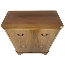 John More of Scarborough -  Edwardian Revival 'Canterbury Cabinet' inlaid mahogany cabinet, fitted with double cupboard decorated with urn motif inlays and banding, flanked by canted fluted uprights, on bracket feet