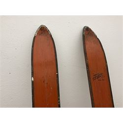 Pair of 1930s wooden skis, with painted metal runners beneath stamped Attenhofer, with retailers label for Ernst Gertsch Central Sports, L206cm