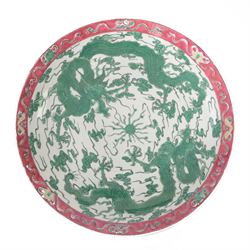Chinese charger, the central panel of dragons chasing a flaming pearl, within a pink banner, D40cm 
