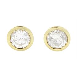 Pair of 18ct gold diamond earrings, each stud bezel set with a single round brilliant cut ...