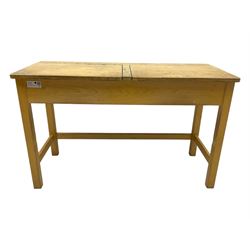 Mid-20th century beechwood school desk, rectangular lift-top desk with storage compartment, supported by square legs with cross stretchers; four matching beech chairs (5)
