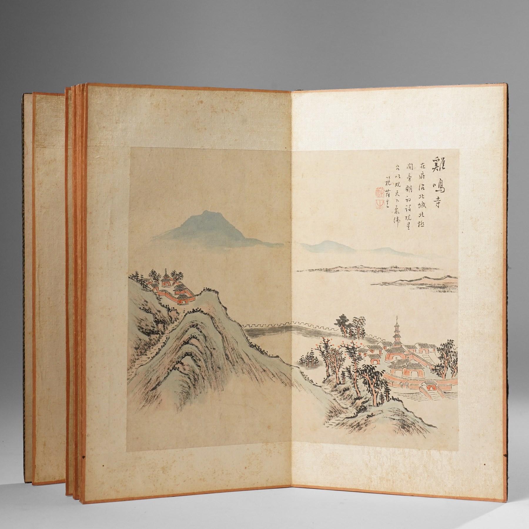 Chinese fold out book, comprising 12 hand-coloured woodblock landscapes each bearing inscription and artists seal  