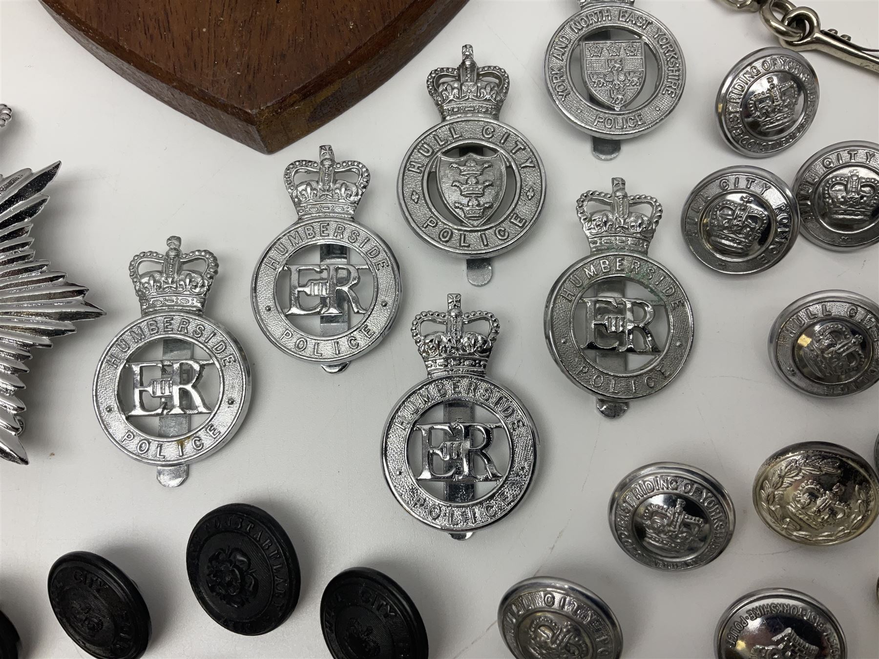 Police - large quantity of cap and collar badges, collar numbers and buttons for Hull City Police, Humberside Police, Lincolnshire Constabulary, York & North East Yorks Police etc; all queen's crown; and three helmet plates including one king's crown