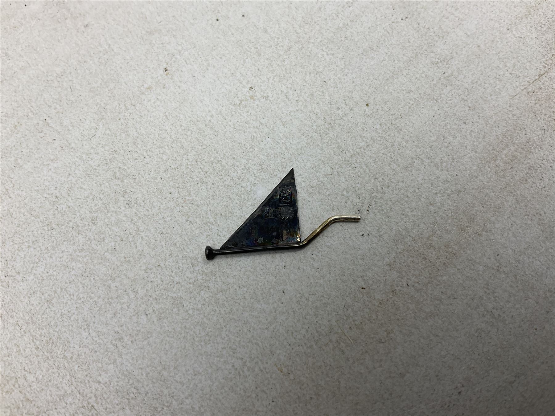 Chinese miniature silver model of a junk ship, with textured sails, mounted upon a carved wooden stand, H14cm