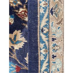 Persian indigo ground rug, the central pointed pole medallion surrounded by scrolling garlands, the guarded ivory border decorated by repeating foliate motifs