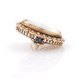 19th century gold pearl portrait brooch, set with a circular miniature of a woman in 18th century dress on ivory, under a glazed panel, with split pearl surround, to a pierced scalloped gallery. This lot has been registered for sale under Section 10 of the APHA Ivory Act