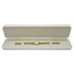 Zenith ladies 9ct gold quartz wristwatch, white enamel dial with baton hour markers, on integral 9ct gold bracelet strap