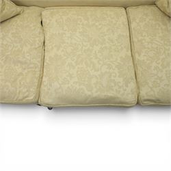 19th century Queen Anne style cream foliate upholstered three seat settee, the shaped and waisted back with serpentine cresting, padded arms over loose seat cushions, raised upon carved cabriole supports with shell carved knees