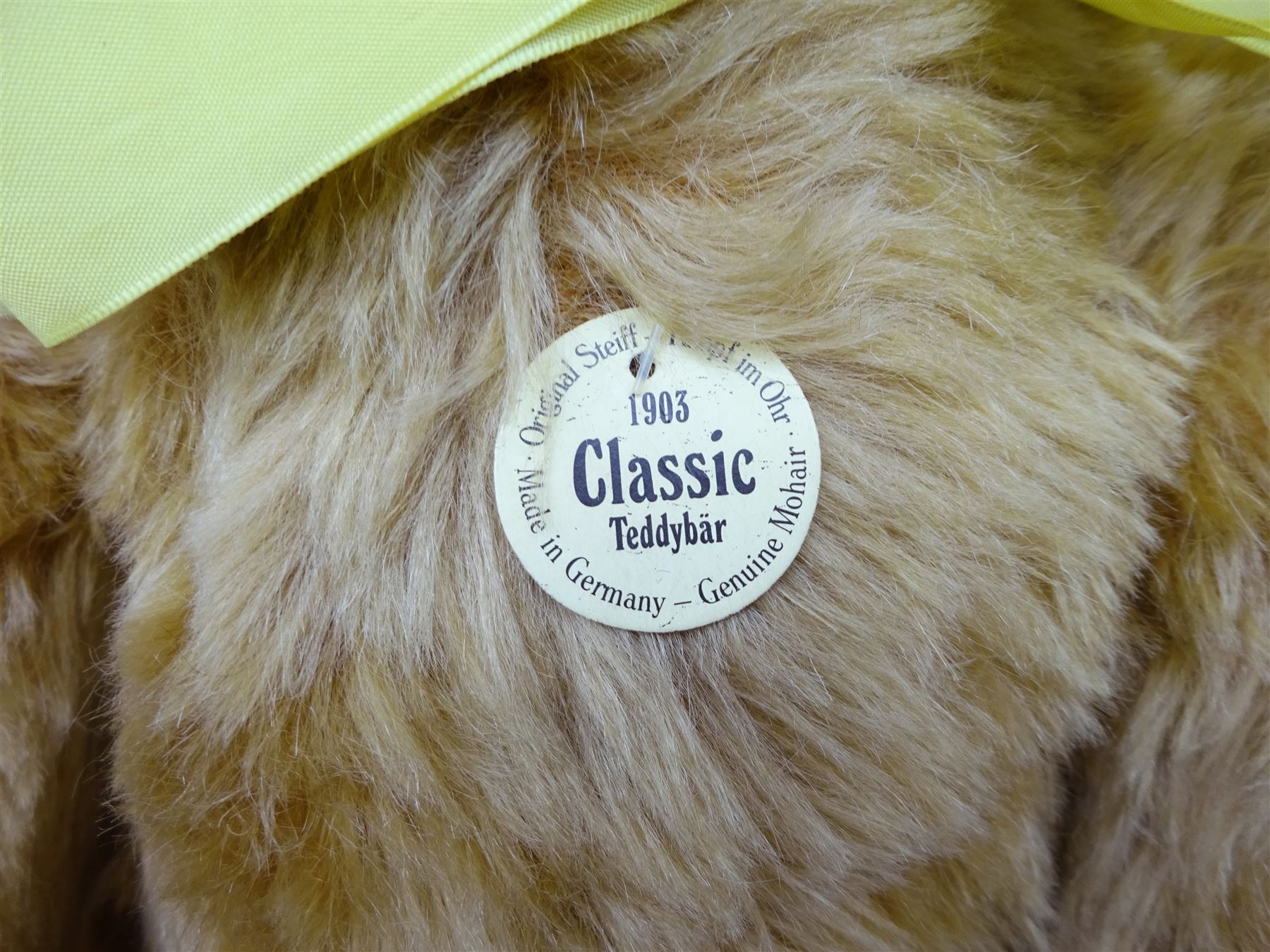 Steiff Replica 1903 Classic teddy bear, the golden mohair body with press squeaker and card tag No.000201 H21