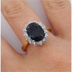 18ct gold oval sapphire and round brilliant cut diamond cluster ring, hallmarked, sapphire approx 3.30 carat, total diamond weight approx 0.70 carat