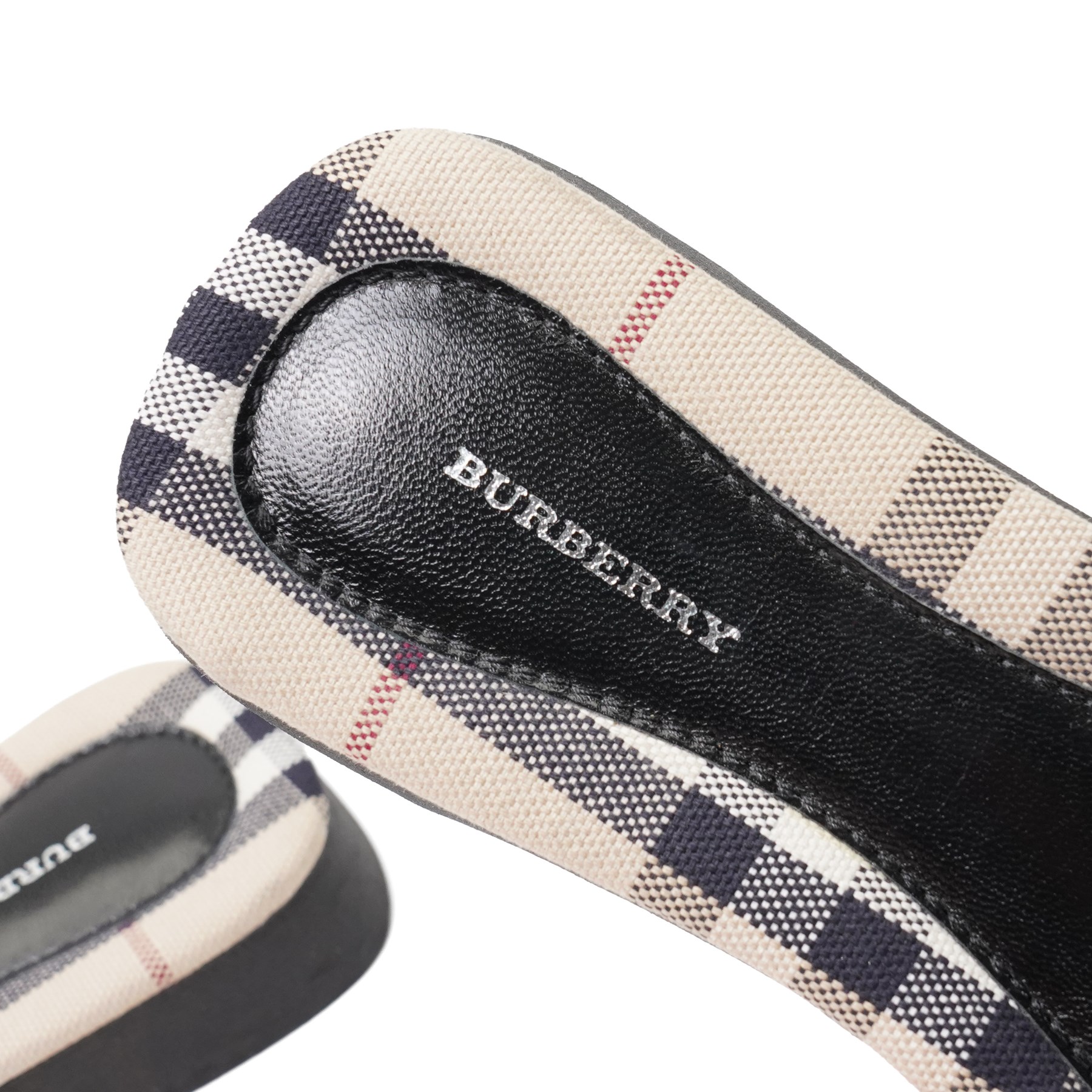 Christian Louboutin and Burberry - two pairs of designer shoes, comprising black leather Christian Louboutin low-top sneakers with black spike-studded toe caps and signature red soles, size 40, with dust bag, together with Burberry check canvas and red transparent strap sandals, size 39, with box and dust bag (2)