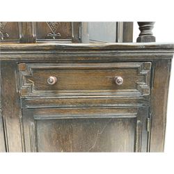 20th century oak court cupboard, arcade carved frieze over baluster supports with demi-hexagon cupboard with lozenge carved facias, the base fitted with two drawers over double cupboard, each with heavily moulded edges