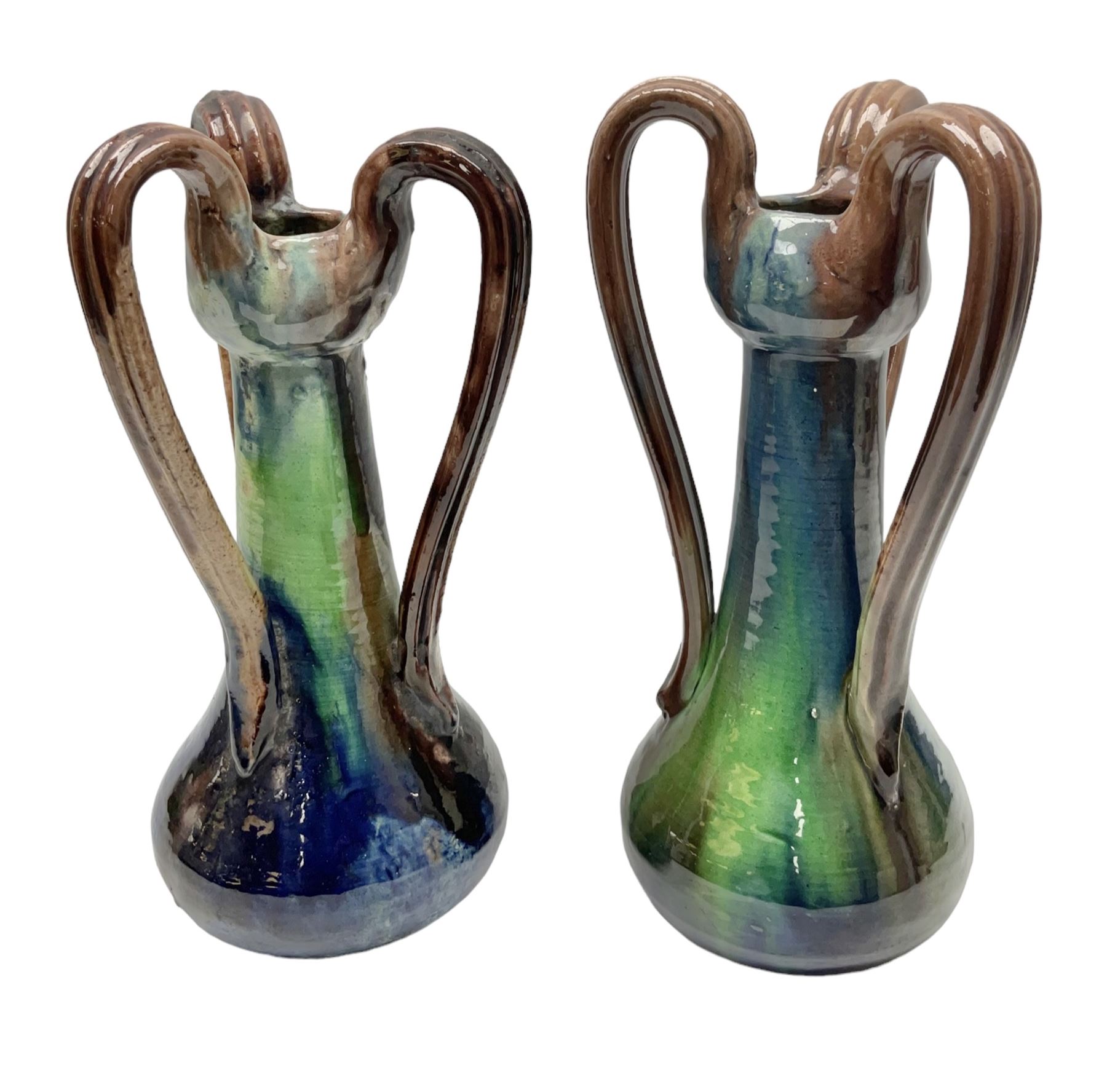 Pair of Art Nouveau style vases, probably Belgian, each with merging blue, brown and green decoration and three handles, impressed LSV beneath, H32cm