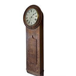 A late 19th century English oak cased wall clock retailed by R, Wilson, Nuneaton (Warx) c 1880, in figured oak case with a short spire topped door and 18” turned wooden bezel, with a 12” painted dial, Roman numerals, minute track and steel spade hands, flat bevelled glass within a brass bezel, dial pinned via a false plate to a weight driven 8- day rack striking movement striking the hours on a bell (strike components removed but present), With pendulum, weights and key.



