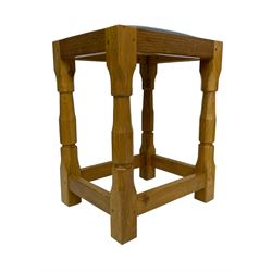 Brian Haw (former Mouseman carver) - Yorkshire oak stool, blue leather upholstered seat with stud band, on octagonal supports joined by plain stretchers